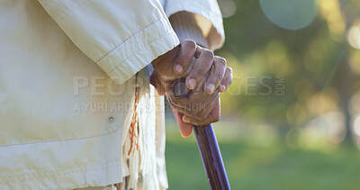 Buy stock photo Hands, walking stick and person with disability outdoor for rehabilitation, support or help in retirement. Closeup, sick senior and cane for balance of parkinson, arthritis and healthcare aid in park