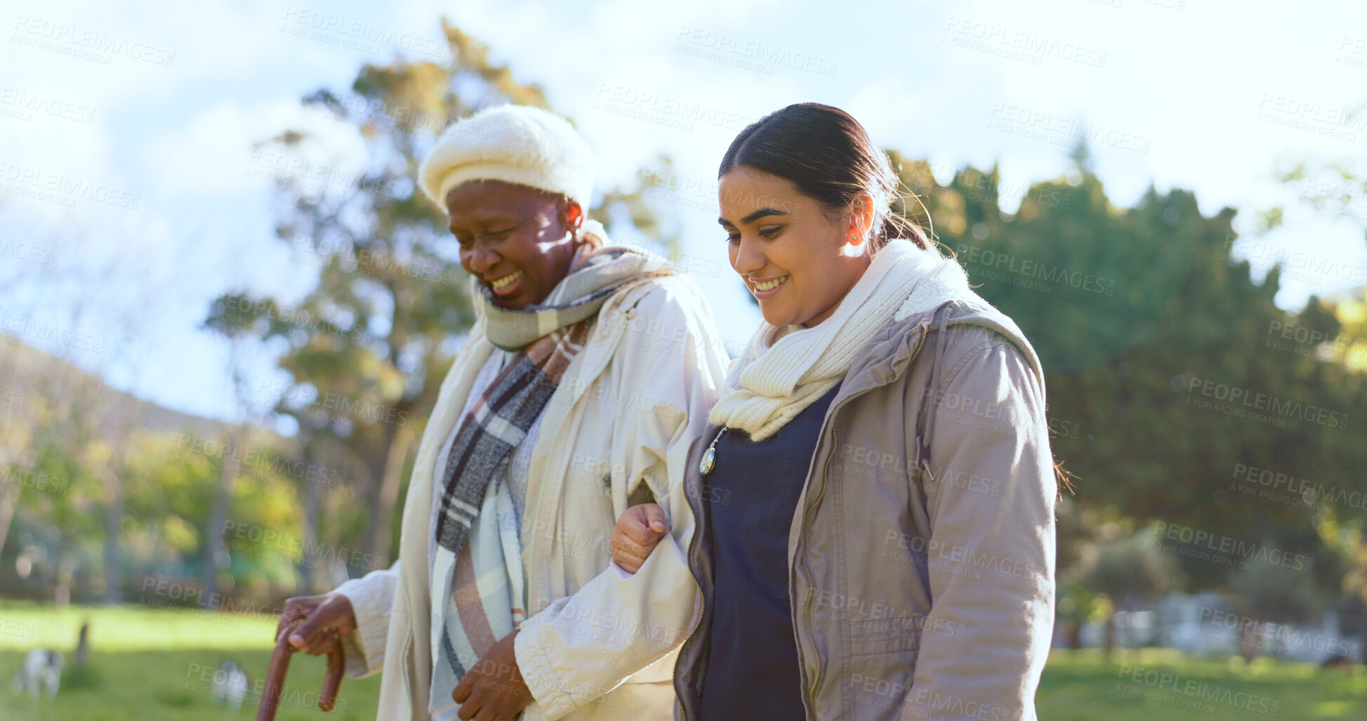 Buy stock photo Senior care, old woman with cane and nurse in park with support, help or trust at nursing home. Retirement healthcare, elderly person and happy caregiver walk and talk in garden together with smile.