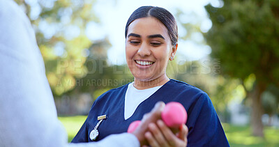 Buy stock photo Hands, caregiver and dumbbell in support for exercise, workout or fitness in a park with happiness. People, professional or nurse with weightlifting for physiotherapy, wellness and health outdoor