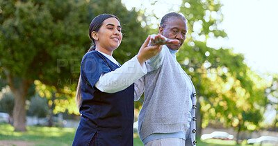 Buy stock photo Elderly, woman and caregiver with arm stretching for exercise, workout or fitness in a park with smile. People, professional or nurse with activity for physiotherapy, wellness and health in nature