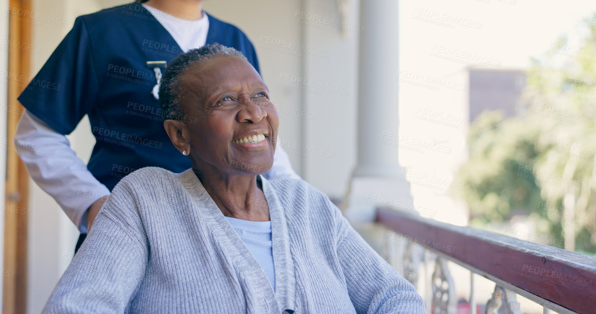 Buy stock photo Old woman, wheelchair and nurse outdoor for smile in nature, balcony or elderly wellness. Medical caregiver, black patient and support for person with a disability or retirement home, air or sunlight