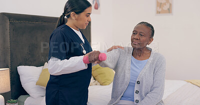 Buy stock photo Doctor, elderly woman and dumbbell on bed to help, exercise and wellness in physiotherapy. Nurse, senior african patient or rehabilitation in bedroom, physical therapy or healthcare in nursing home