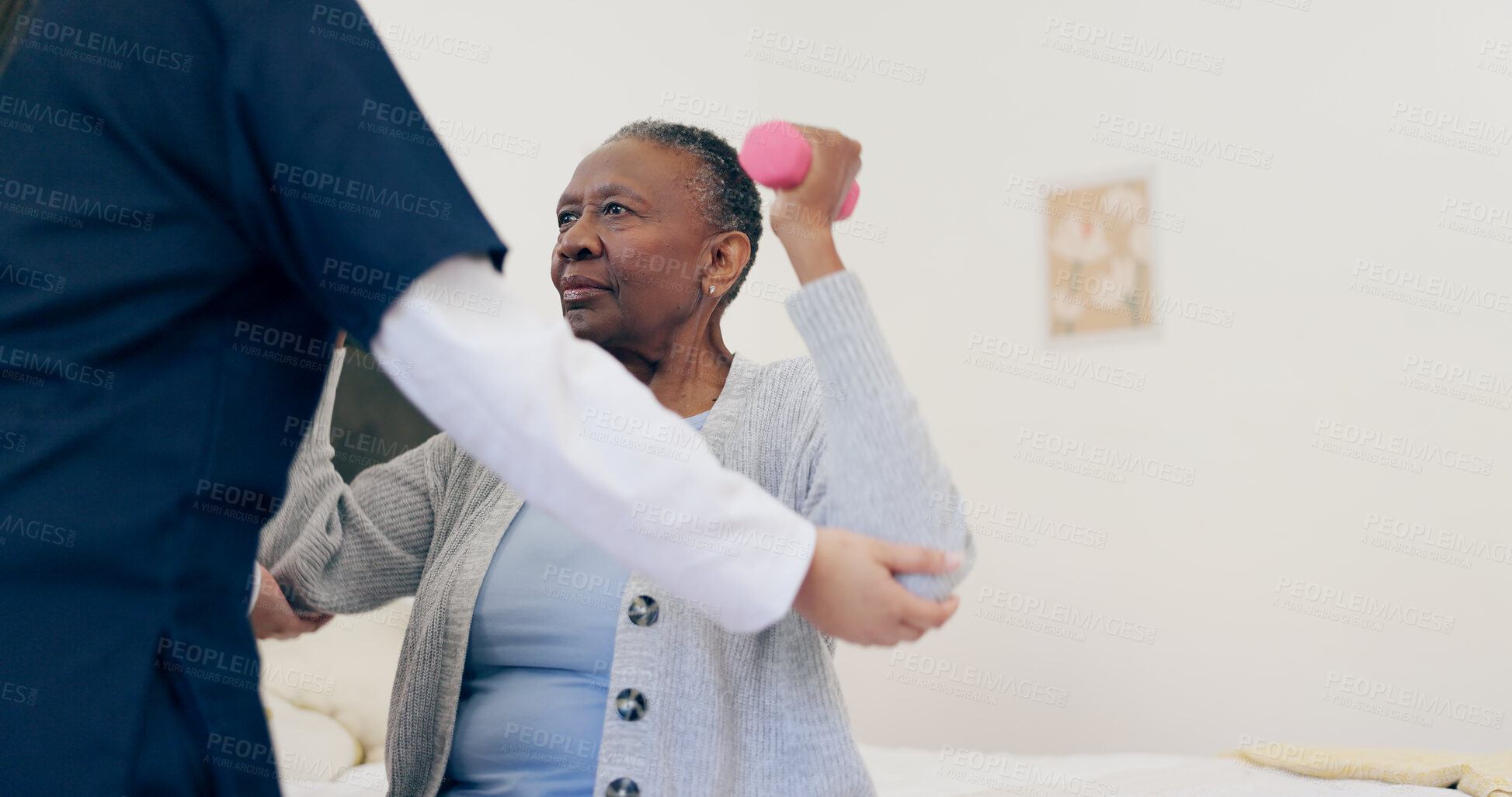 Buy stock photo Caregiver, elderly woman or dumbbell in bedroom to help, exercise or workout in physiotherapy. Nurse, black person or senior care in physical therapy on bed, wellness support or healthcare service 