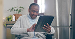 Old woman, wheelchair and tablet happy for online connection, internet reading or social media search. Black person, mobility assistance and digital typing or distance communication, email in kitchen