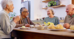 Conversation, tea party and a group of senior people in the living room of a community home for a social. Friends, smile or retirement with elderly men and women together in an apartment for a visit