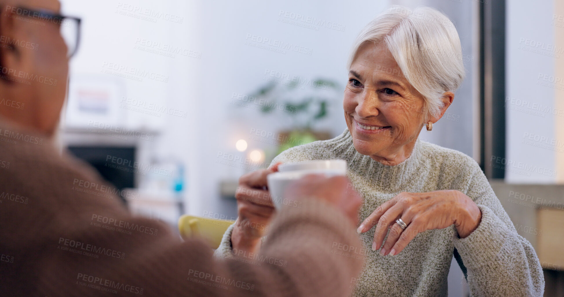 Buy stock photo Cheers, retirement and a senior couple drinking tea in the dining room of their home together in the morning. Smile, toast or conversation with an elderly man and woman in their apartment for romance