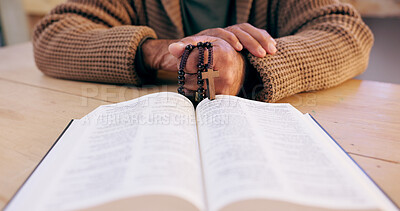 Buy stock photo Hands, rosary and bible with closeup for faith, peace and hope at desk, home or praying for worship. Person, cross and jewelry for religion, mindfulness and connection to holy spirit, Jesus or God