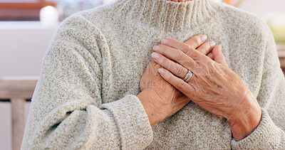 Buy stock photo Hands, breathing and heart attack with an elderly person in the dining room of a retirement home closeup. Healthcare, medical or emergency and a senior adult with chest pain for cardiac arrest