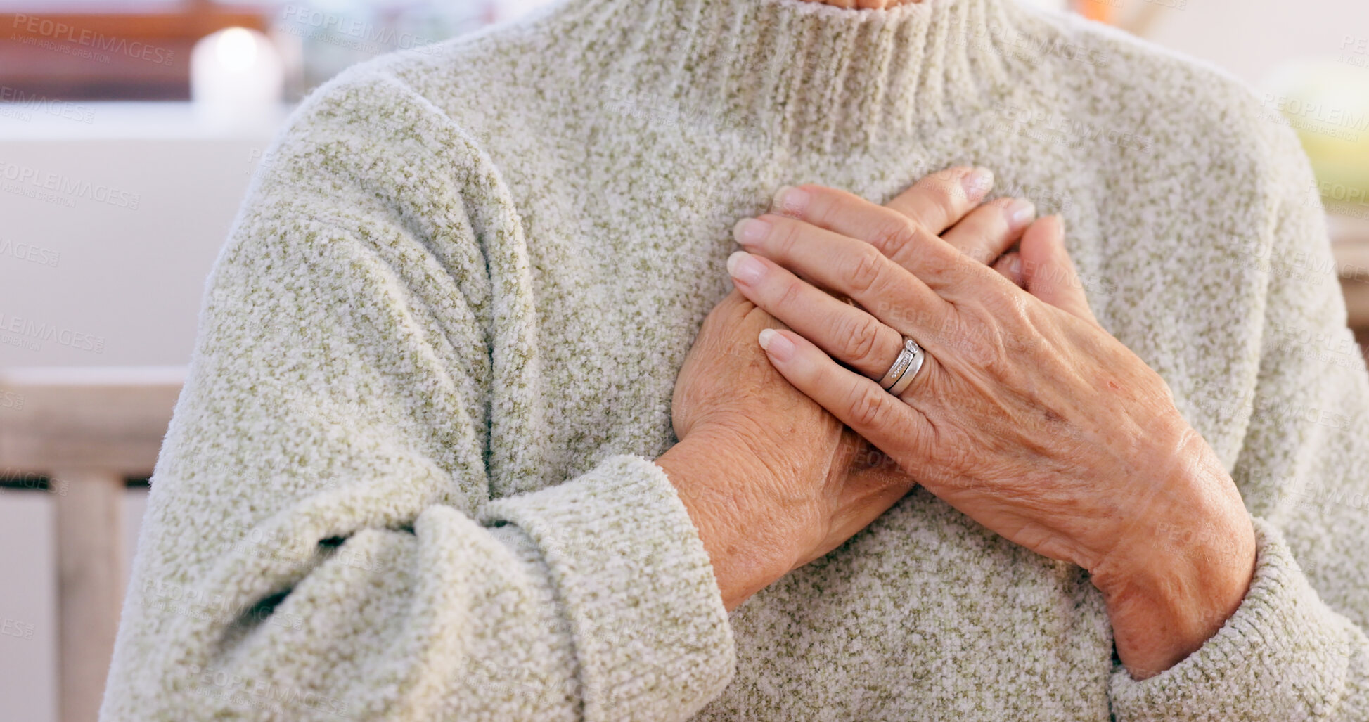 Buy stock photo Hands, breathing and heart attack with an elderly person in the dining room of a retirement home closeup. Healthcare, medical or emergency and a senior adult with chest pain for cardiac arrest