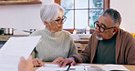 Couple, documents and reading for insurance in retirement, planning and bills or paperwork. Senior people, marriage and communication or discussion for future, saving and finance in kitchen at home
