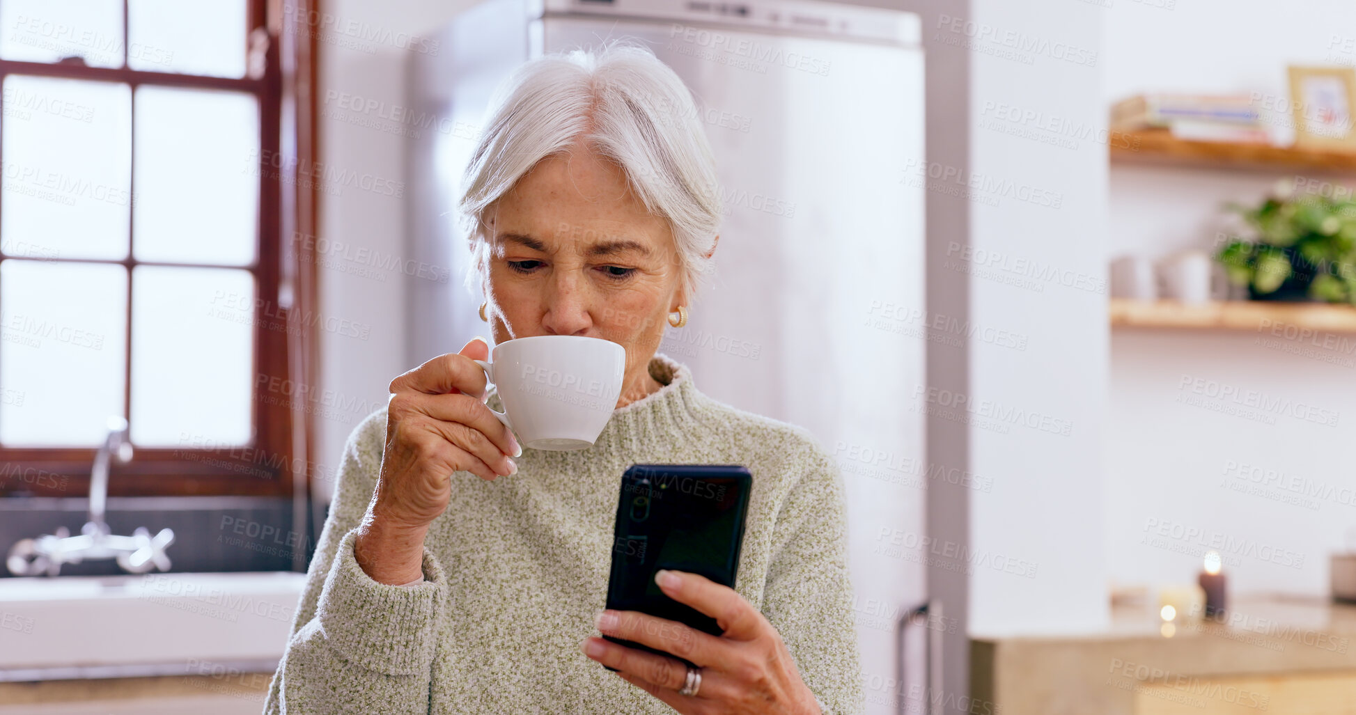Buy stock photo Senior woman, tea and phone with reading, texting and communication on web, app and typing in home. Elderly lady, drink and coffee cup for espresso with smartphone, social network or notification