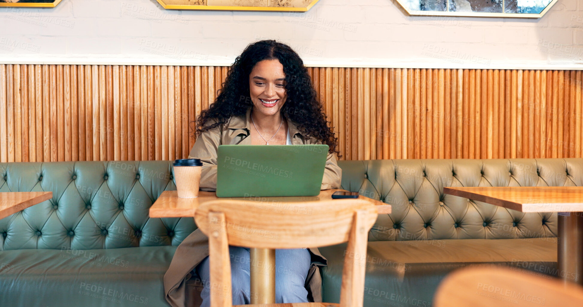 Buy stock photo Happy woman in coffee shop, typing on laptop and remote work, reading email or writing blog, article or search on technology. Computer, freelancer or copywriting in cafe, store or restaurant at table