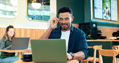Man, reading glasses and laptop at cafe for online research, remote work and review of blog or social media. Happy freelancer worker in coffee shop or restaurant with computer for menu or information