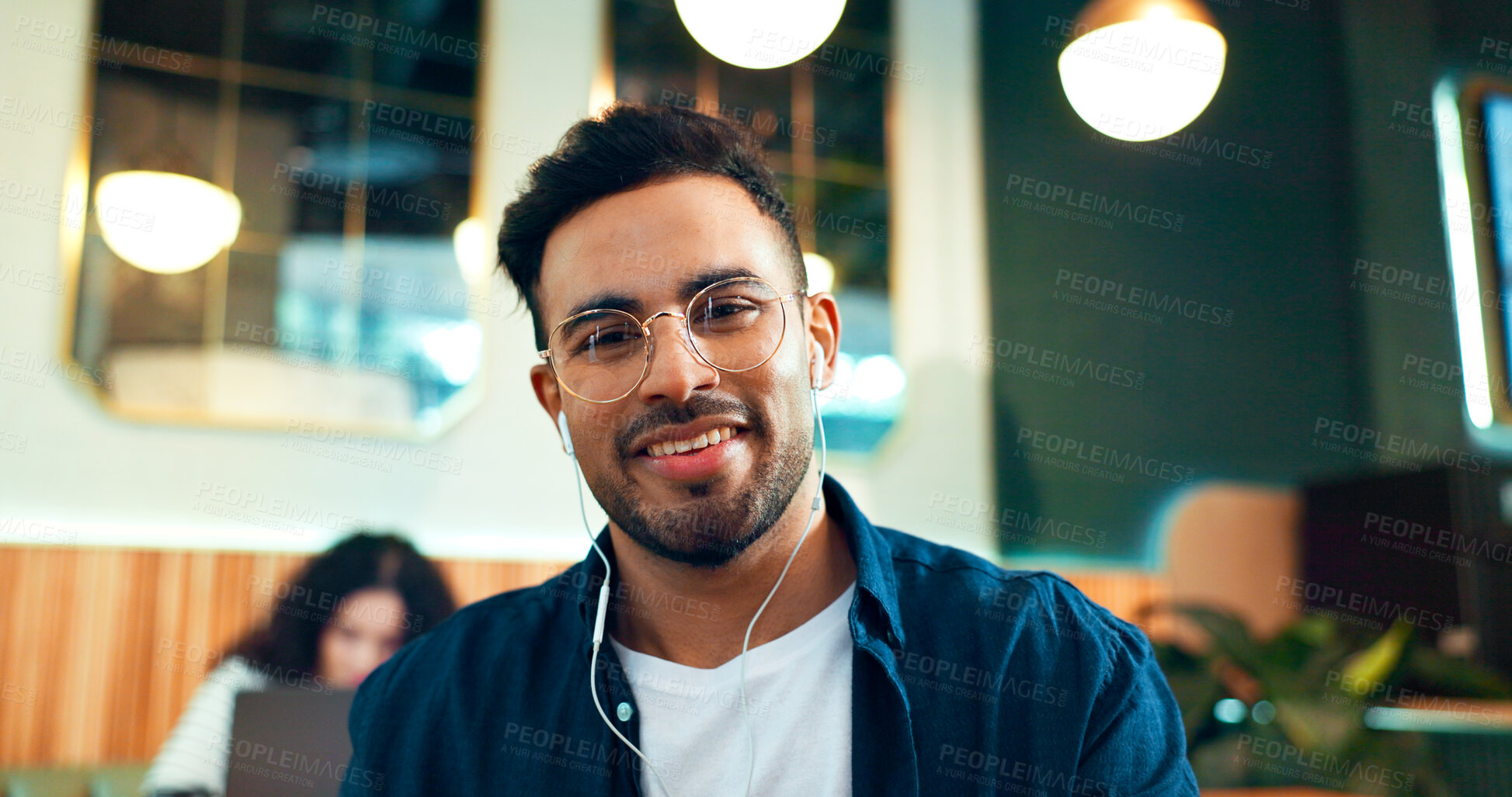 Buy stock photo Man, portrait and smile with glasses in restaurant for relax, remote work or networking with earphones in the morning. Person, face and listening to music for peace, coffee break or happiness in cafe