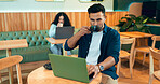 Man, coffee shop drink and laptop for online research, remote work and typing on website, blog or social media. Freelancer, writer or customer listening to music on computer in cafe or restaurant