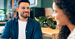 Man, glasses and dating with smile in coffee shop with girlfriend for lunch, food or bond. Mexican person, happy or excited for conversation, story or listen for quality, time or care in relationship