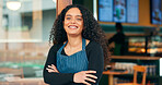 Businesswoman, cafe and arms crossed with smile, manager and startup for store, coffee shop or restaurant. Portrait, entrepreneurship or waitress for retail, proud or confident at door, happy or open