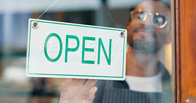 Man, small business or open sign on door in coffee shop or restaurant for service or advertising. Ready, start or entrepreneur holding board, poster or welcome for message on window in diner or cafe