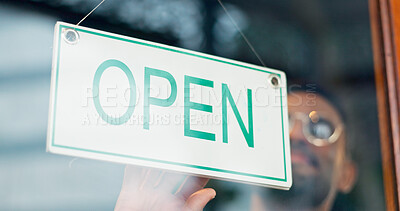 Man, business owner or open sign on door in coffee shop or restaurant for service or advertising. Ready, start or entrepreneur holding board, poster or welcome for message on window in diner or cafe
