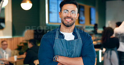Waiter, man and portrait with arms crossed or smile for service, welcome or server in coffee shop. Barista, person and face with happiness for hospitality, career or confidence in restaurant or cafe