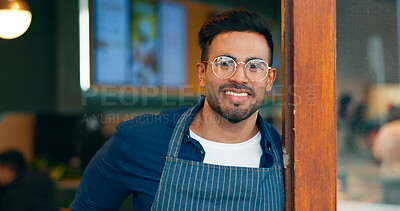 Buy stock photo Portrait, entrance and happy man, restaurant business owner or coffee shop manager smile for cafeteria service. Hospitality, management and confident barista, waiter or server leaning on cafe door