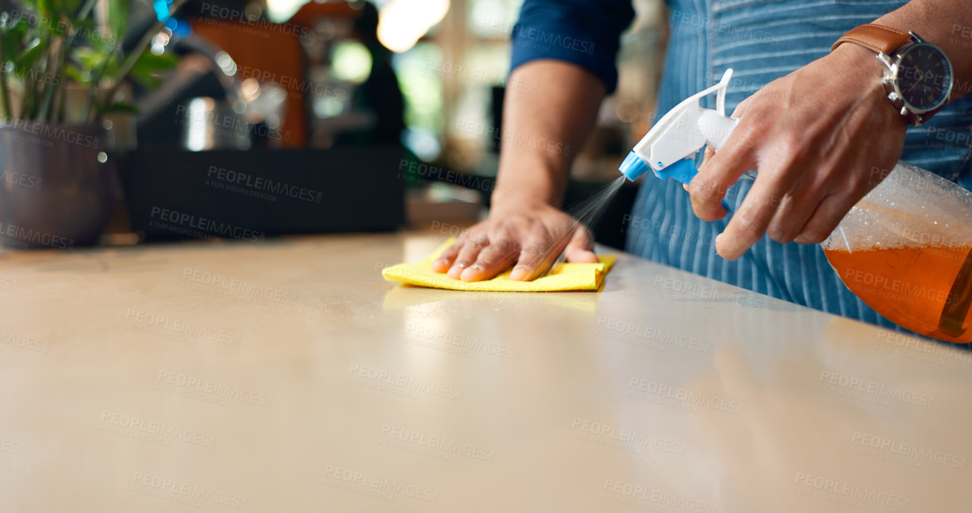 Buy stock photo Waiter, hands and cleaning table in restaurant for dust, bacteria and dirt with cloth, spray or detergent. Barista, person or wipe wooden furniture in coffee shop or cafe with chemical liquid closeup