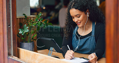 Buy stock photo Waitress, woman and writing in cafe with smile, notebook and music for customer order or sales inventory. Barista, person or employee at store window for service checkout, or working on menu in diner