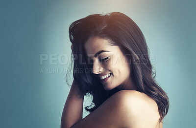 Buy stock photo Cropped shot of a beautiful young woman posing in the studio