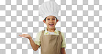 Child, happy face and chef hand to show promotion, advertising or deal in studio. Dress up, profession and young boy happy from future career of cooking and open palm for sale with blue background