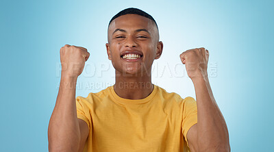 Buy stock photo Man, portrait and excited for success with fist in studio to celebrate deal, promotion or yes to winning lottery on blue background. Happy model, giveaway prize winner or reward for bonus achievement