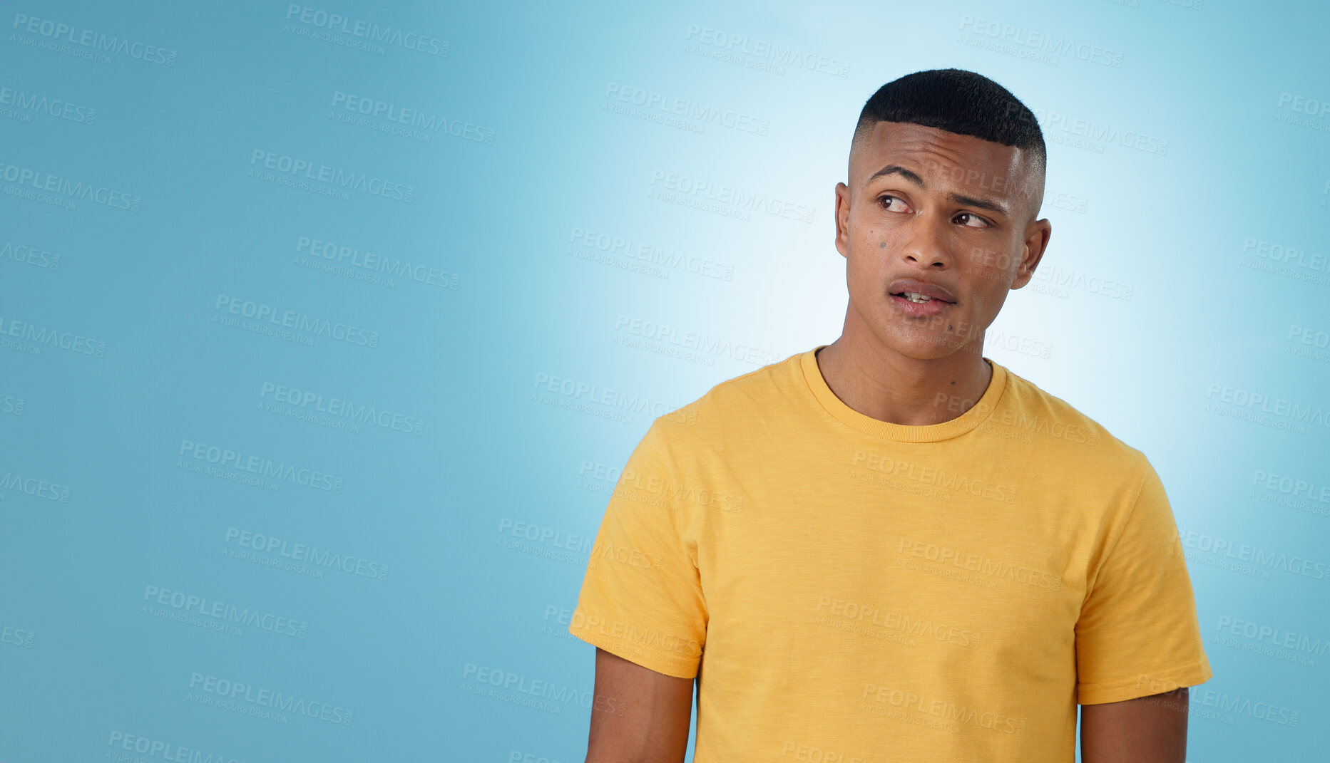 Buy stock photo Thinking, confused or problem solving and a man on a blue background in studio with a question on mockup. Doubt, idea or why with a young person on space for planning or brainstorming a solution