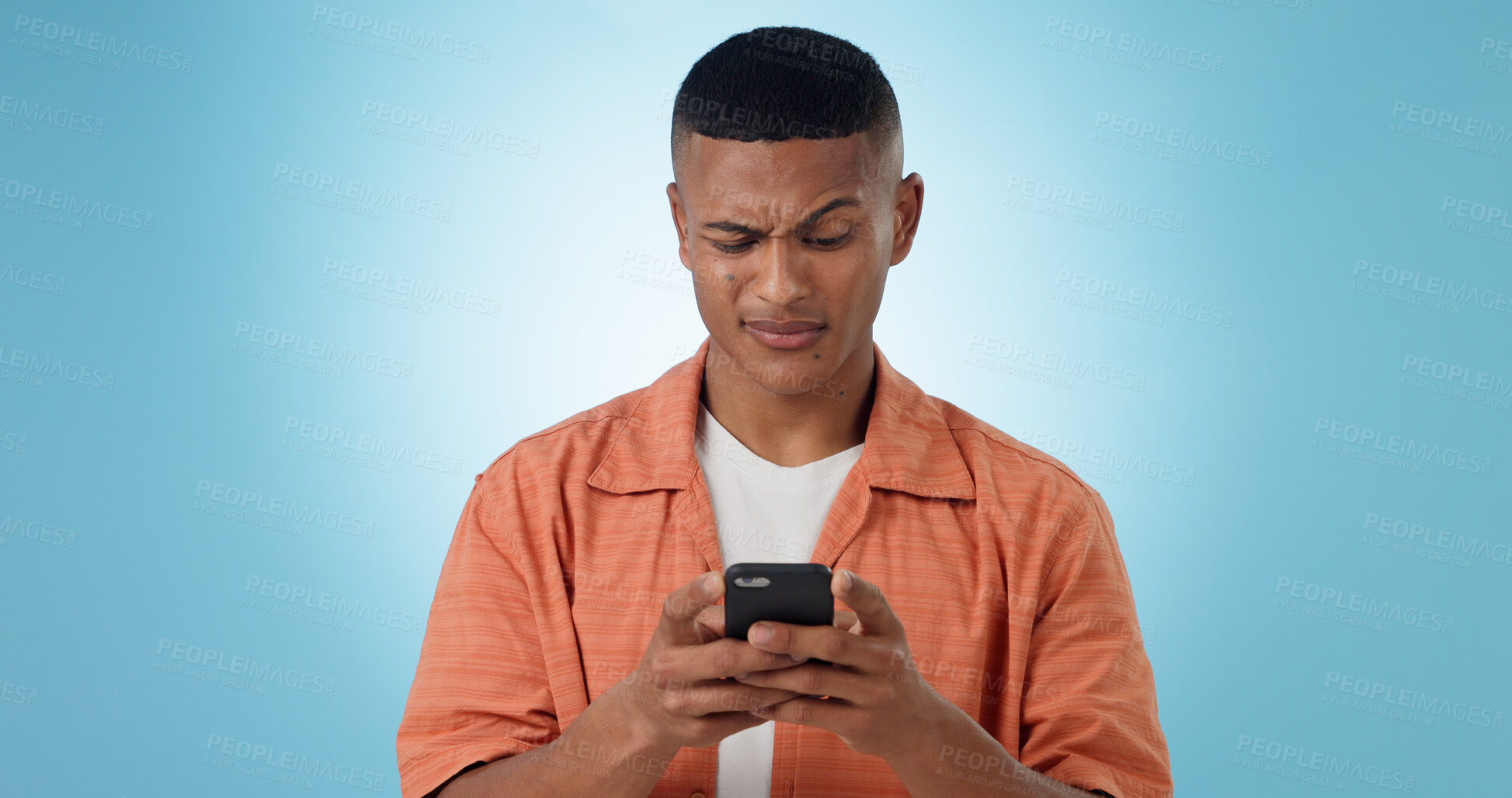 Buy stock photo Expression, confused and man with a smartphone, typing and connection on a blue background. Person, guy and model with a cellphone, mobile user and reaction with doubt, error 404 and contact with app