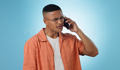 Buy stock photo Man, confused and cellphone in studio for call connection, bad signal or communication. Male person, mobile and internet chat social media or conversation web talking, blue background as mockup space