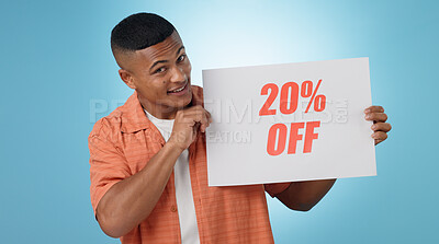 Buy stock photo Portrait, man and poster for sale in studio with mock up for discount on blue background. Cape Town, male model and smile with announcement, promotion and sign on board with presentation in space