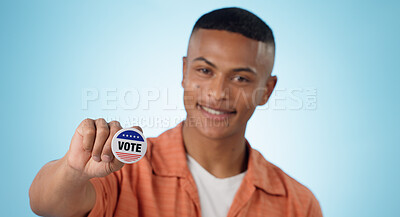 Buy stock photo Man, vote sticker and smile for election, positive and politics for america, government and blue studio background. Badge, voter choice and support for party, registration or hand for voting register