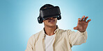 Man, student and VR or futuristic glasses for e learning, 3d software and user experience on blue background. Person with virtual reality vision, education and metaverse technology or games in studio