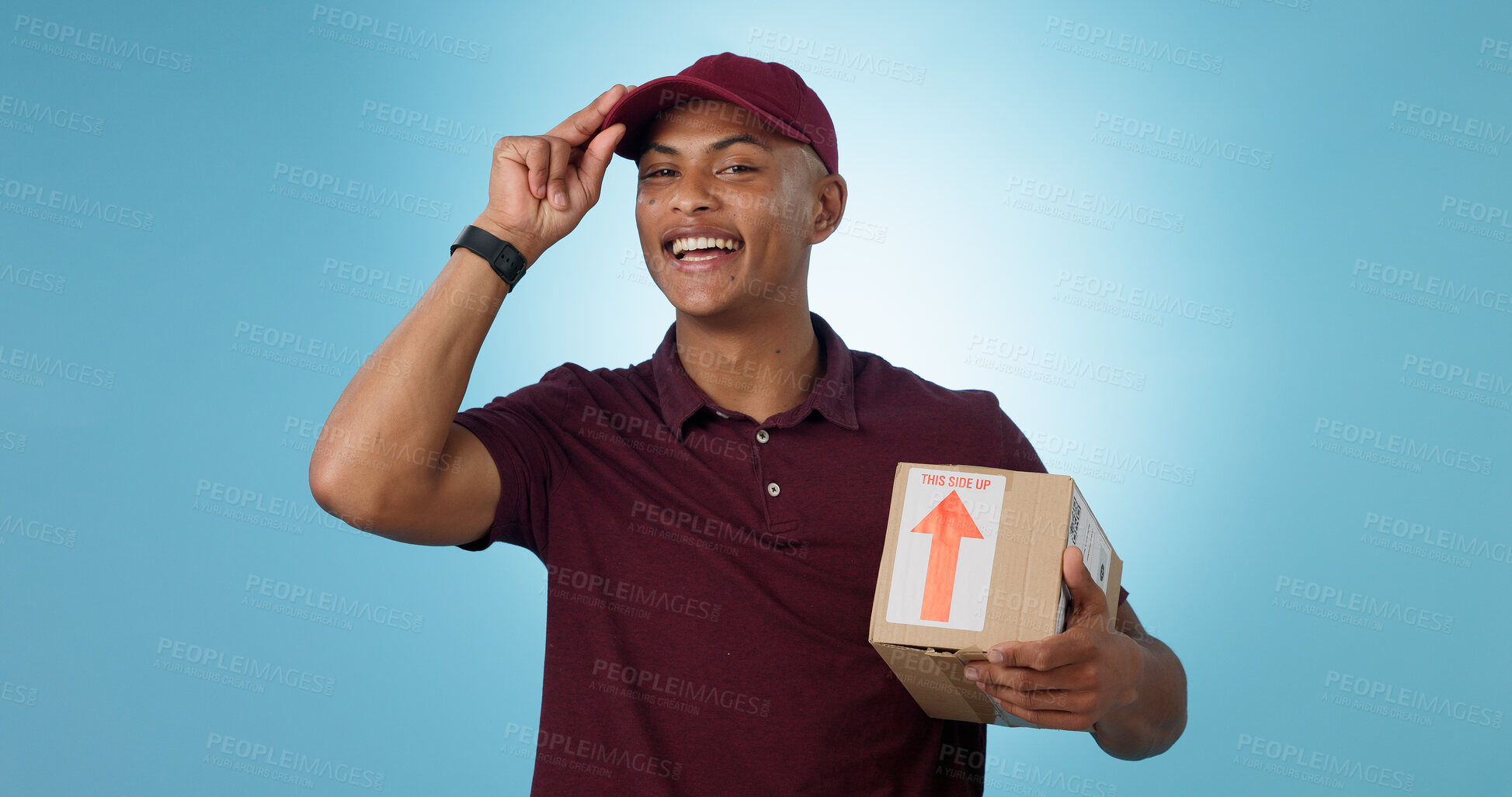 Buy stock photo Greeting, shipping box or portrait of delivery guy in studio with courier service or supply chain package. Happy man, blue background or worker with safe cargo for mail distribution or post services