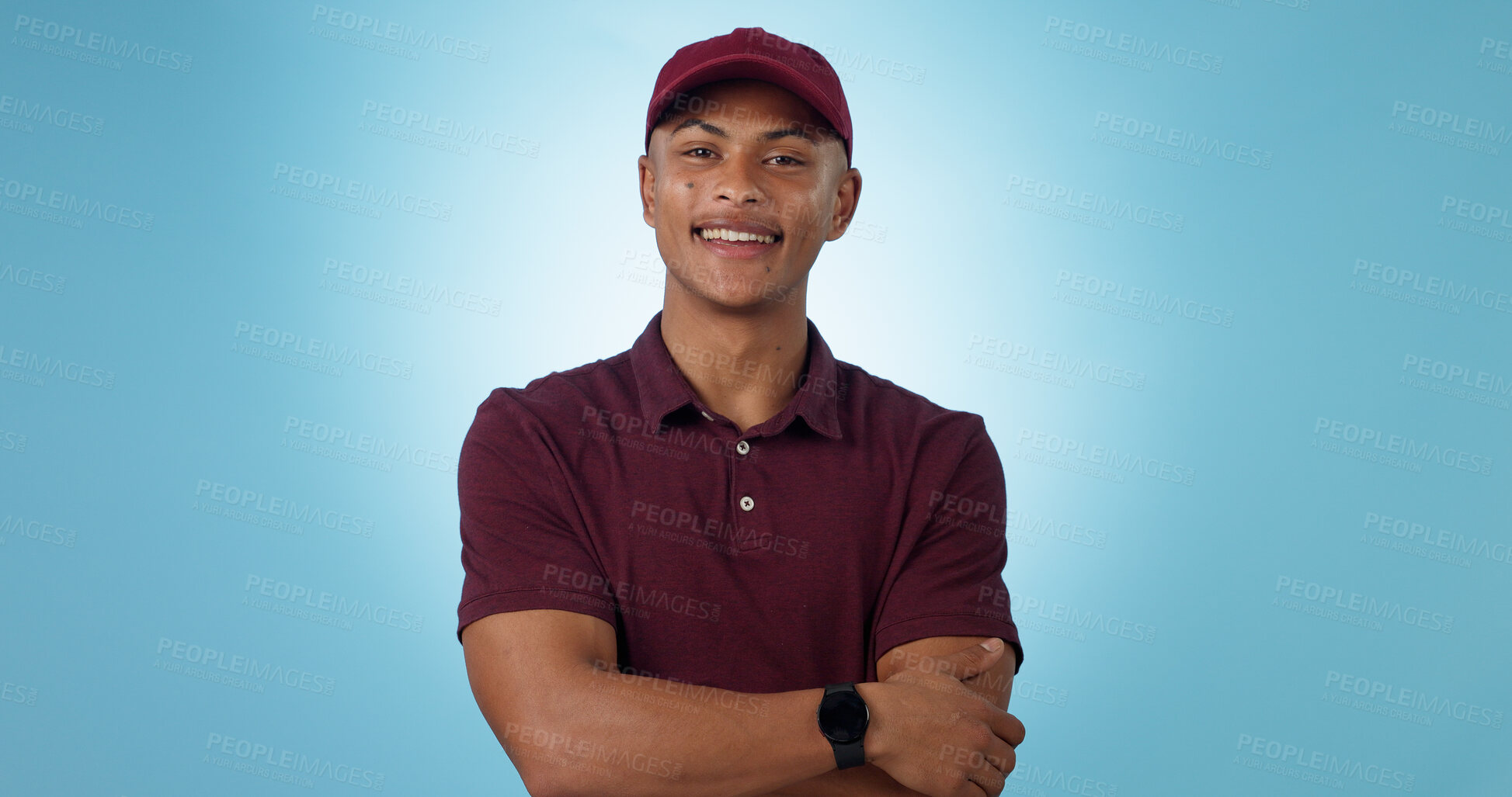 Buy stock photo Delivery man, arms crossed or portrait for distribution or mockup space on blue background. Professional, retail supply chain or happy logistics worker for shipping or courier service in studio