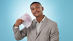 Business man, winning and money fan for success, bonus and lottery prize, stock market profit or cashback in studio. Portrait of winner or trader cash and financial achievement on a blue background