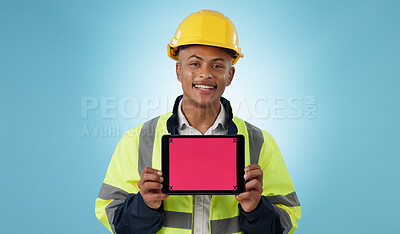 Buy stock photo Engineering man, tablet screen and mockup for industrial presentation of renovation, architecture or design in studio. Portrait of construction worker with digital tracking markers on blue background