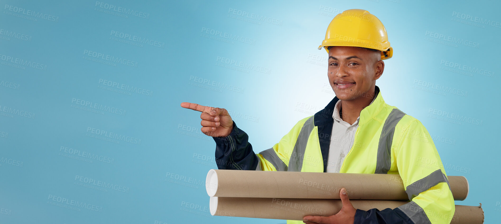 Buy stock photo Man, construction worker and pointing with building plans, safety wear and architect on studio background. Professional, mockup space and industrial blueprint for engineering project, builder and job