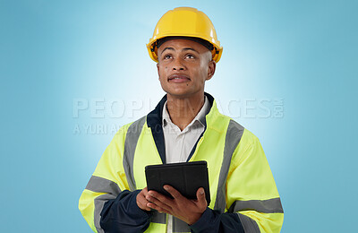 Buy stock photo Engineering, man and tablet for inspection, thinking of renovation or project management on blue background. Construction worker with architecture survey, looking up and digital technology in studio