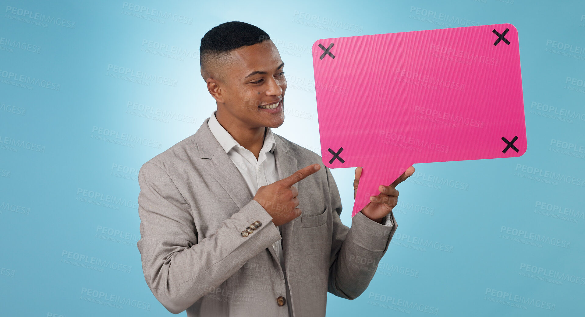 Buy stock photo Business man, speech bubble and presentation of chat poster, social media quote or communication in studio. Young worker pointing to FAQ mockup, career forum and tracking markers on a blue background