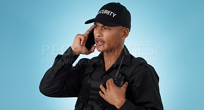 Buy stock photo Security guard, phone call and man with communication in a studio with police and law enforcement. Blue background, surveillance and officer with mobile discussion and talking for safety and danger