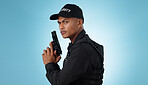 Man, security guard and holding gun for shooting, protection and hands with face, portrait or confident. Target, killing or weapon for criminal, murder or studio background for pistol, crime or eyes