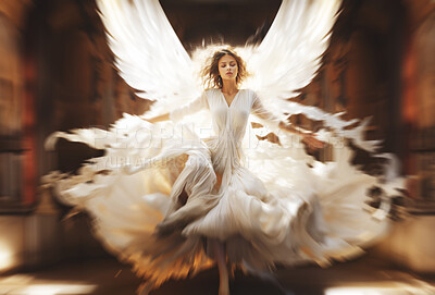 Portrait of angel appearing in white flowing gown. Zoom blur effect.
