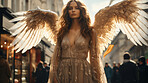 Attractive woman with angel wings. Wearing golden gown in city.