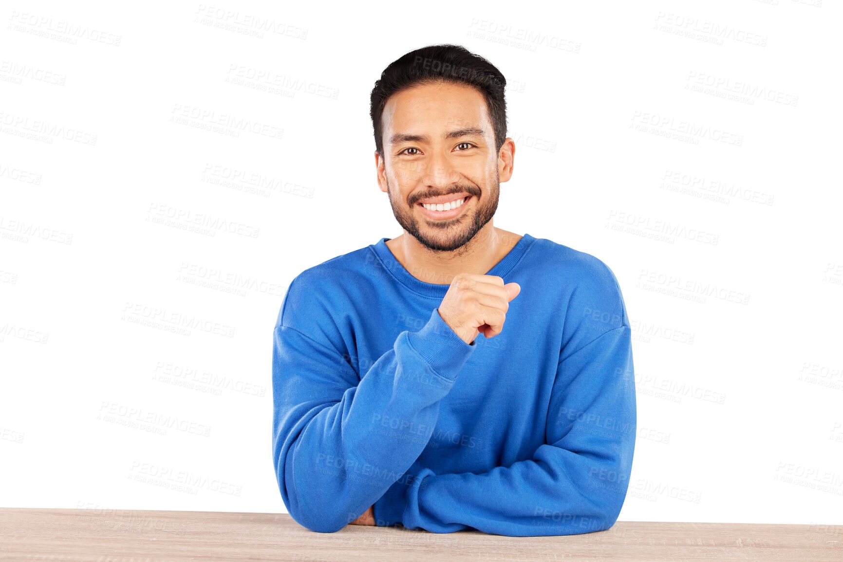 Buy stock photo Portrait, smile and casual with a young indian man sitting at a table isolated on a transparent background. Face, desk and a happy confident person in a blue jersey on PNG with a positive mindset