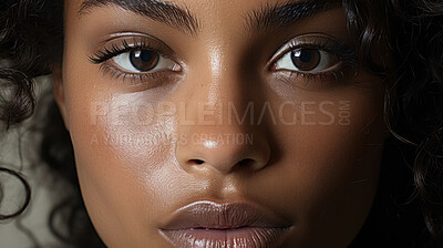 Extreme close-up of model. Make-up, smooth skin, curly hair. Fashion, editorial concept.