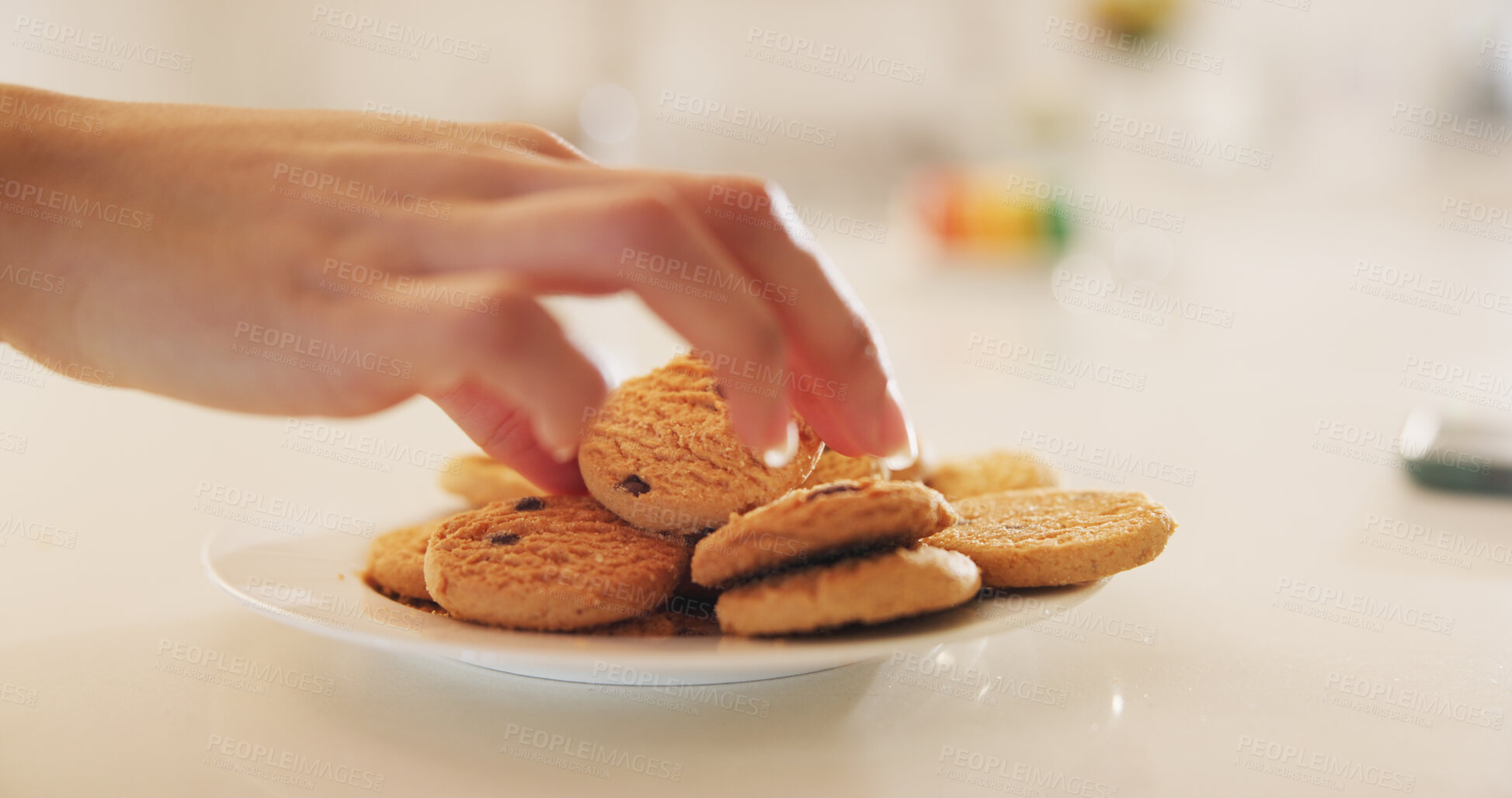 Buy stock photo Hands, cookies and plate on table in home kitchen, eating or hungry for sweets at breakfast. Closeup, biscuits and sugar food of person, dessert or confectionery snack for unhealthy diet in nutrition
